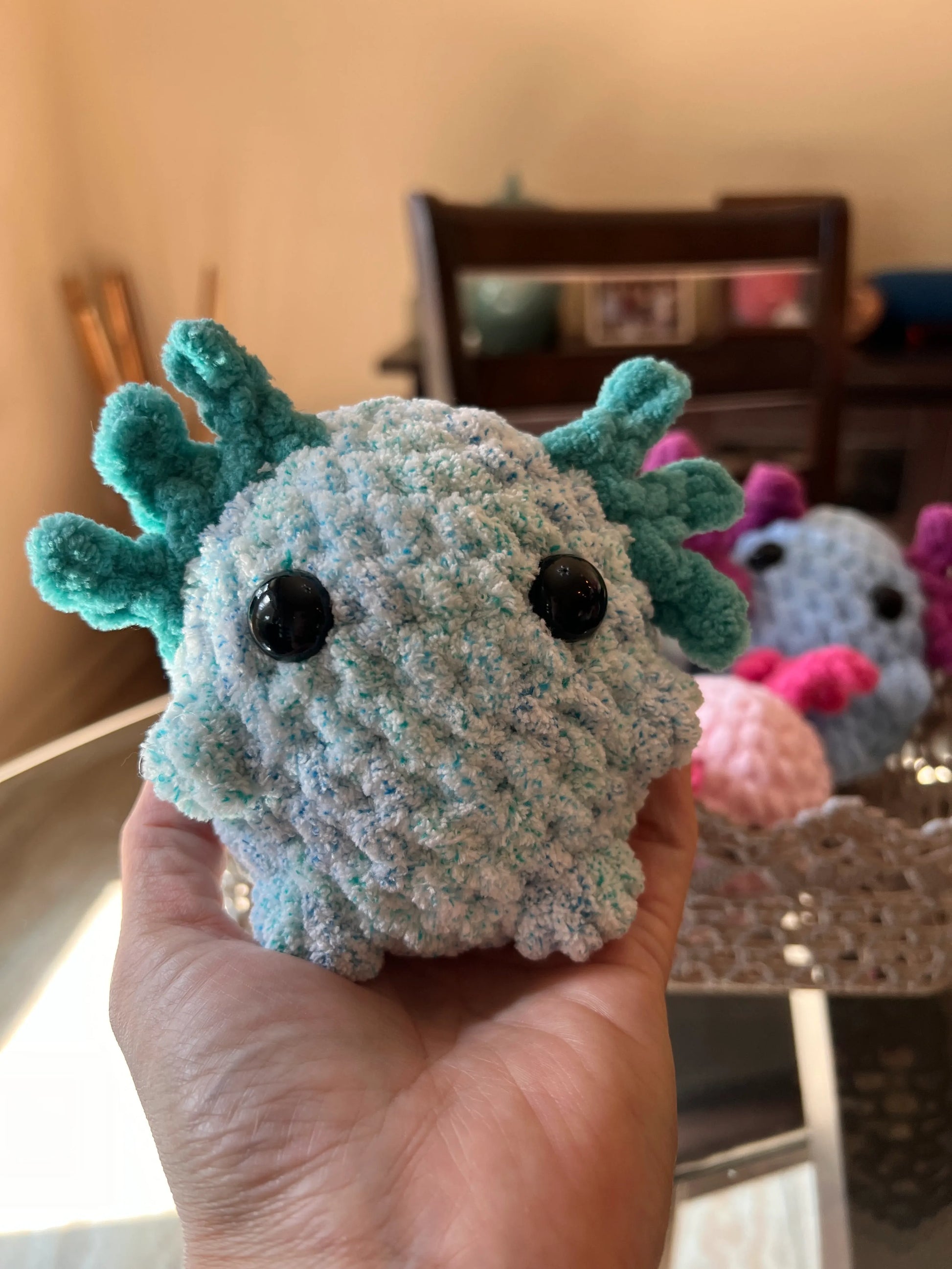 Front view of the alternative turquoise axolotl plushie