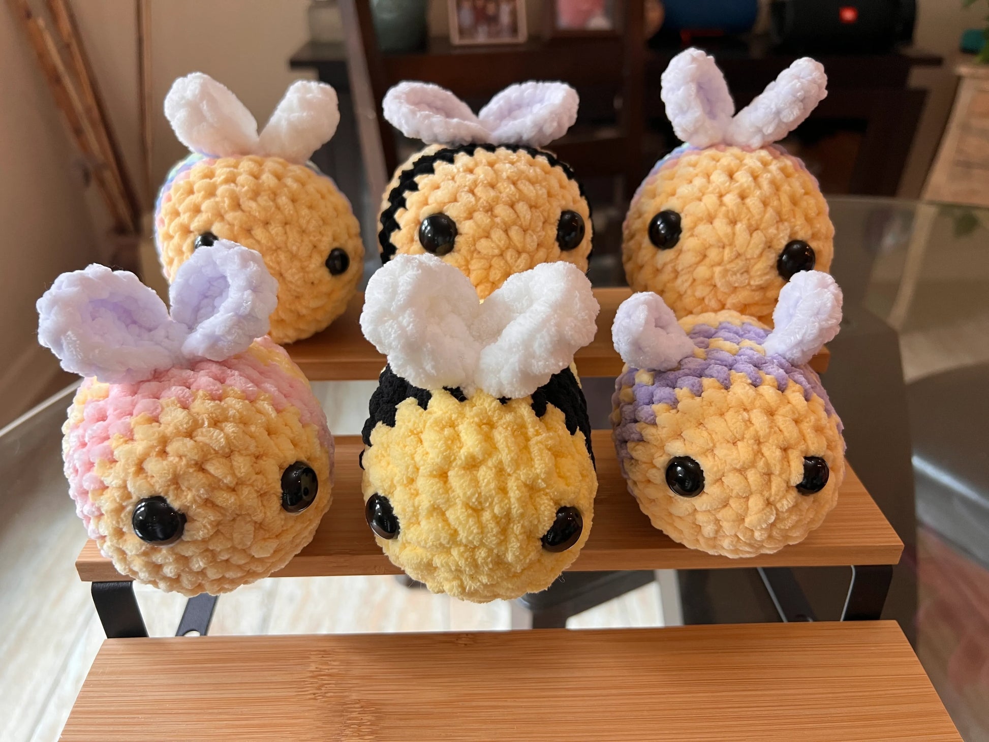 Front view of the bee plushies grouped together