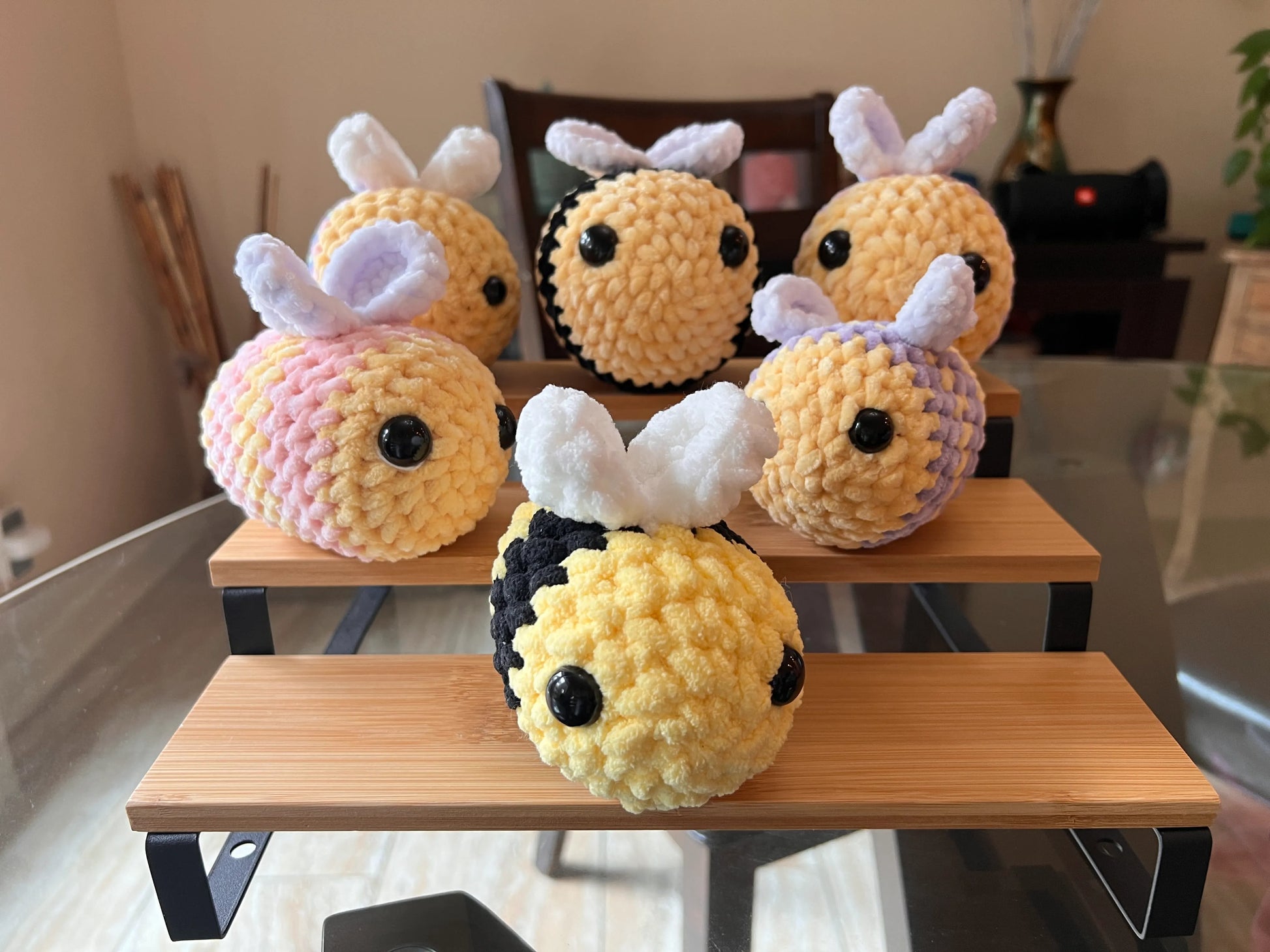 Front view of the bee plushies grouped together