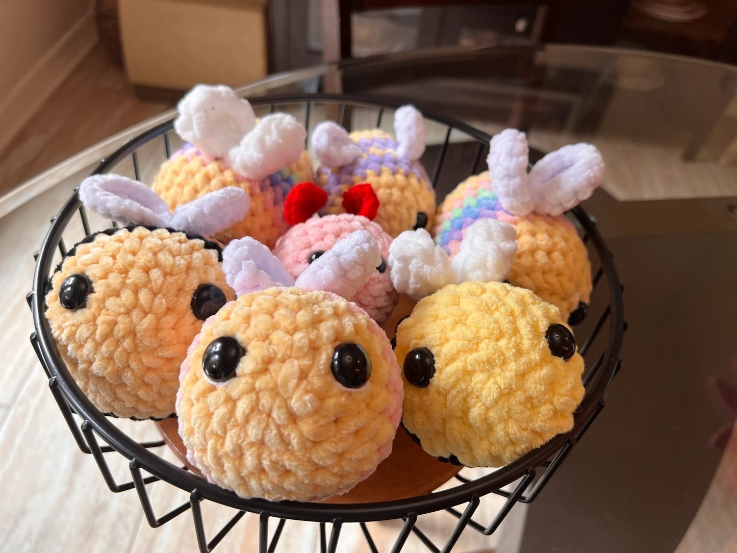 Front view of the bee plushies grouped together