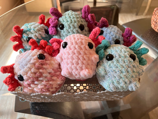 Front view of the chubby axolotl plushies grouped together