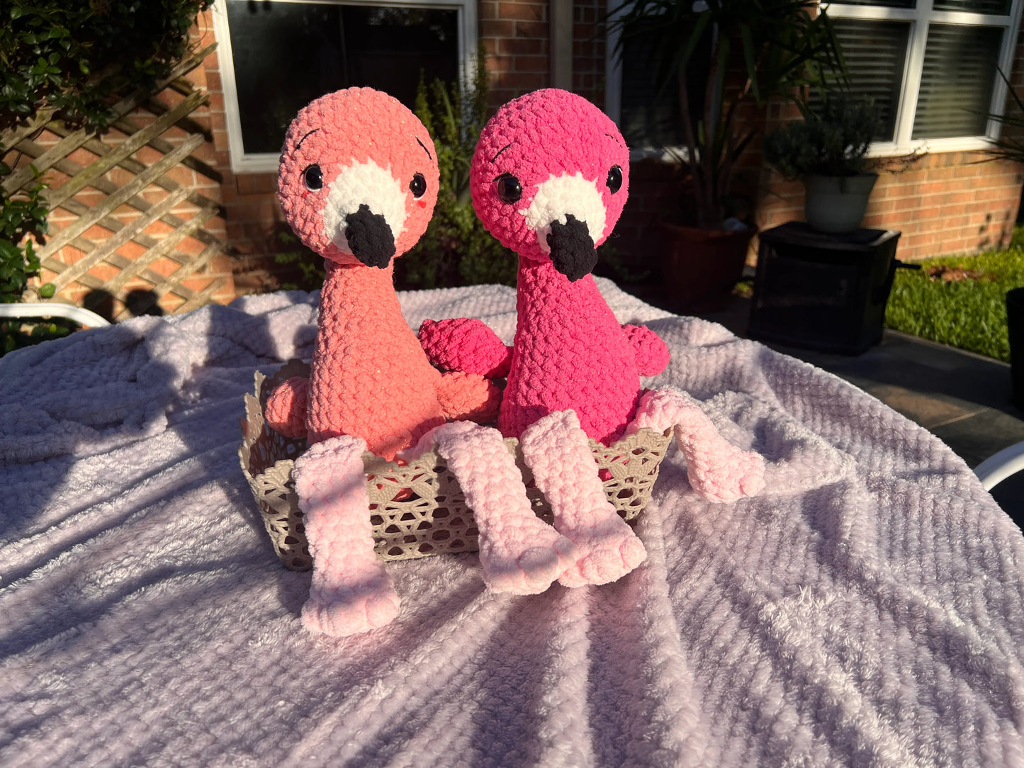 Front view of the flamingo plushies