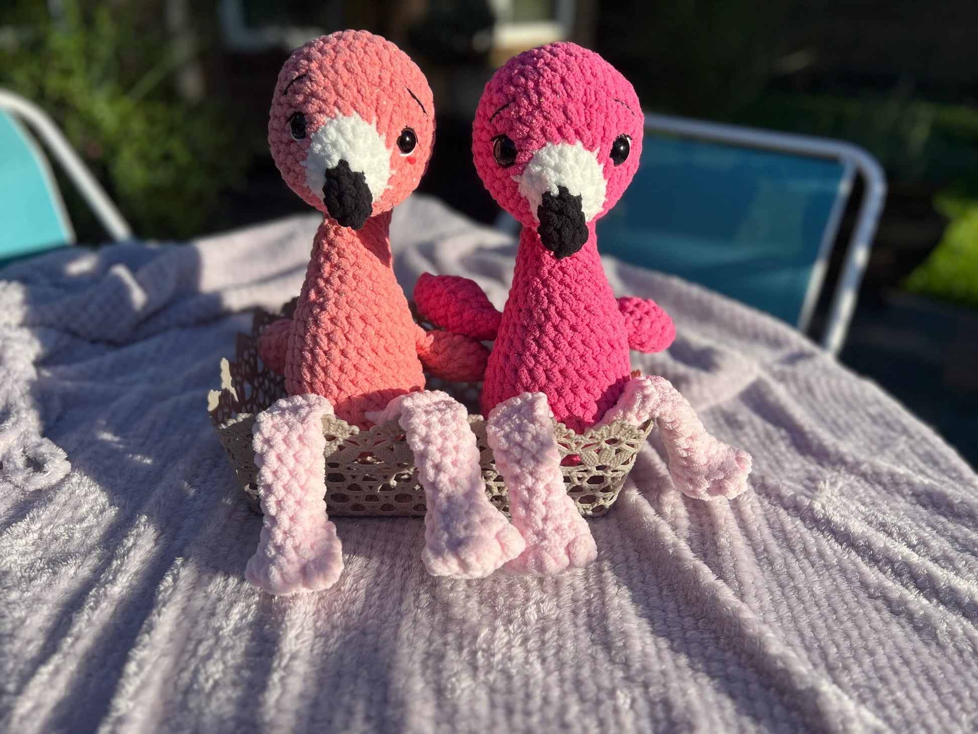 Front view of the flamingo plushies