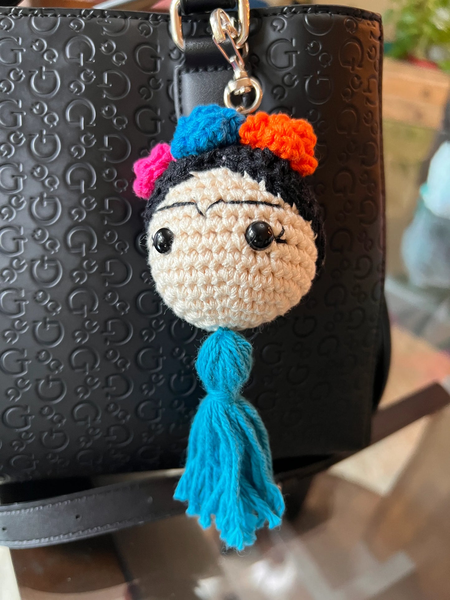 Front view of the Frida keychain plushie