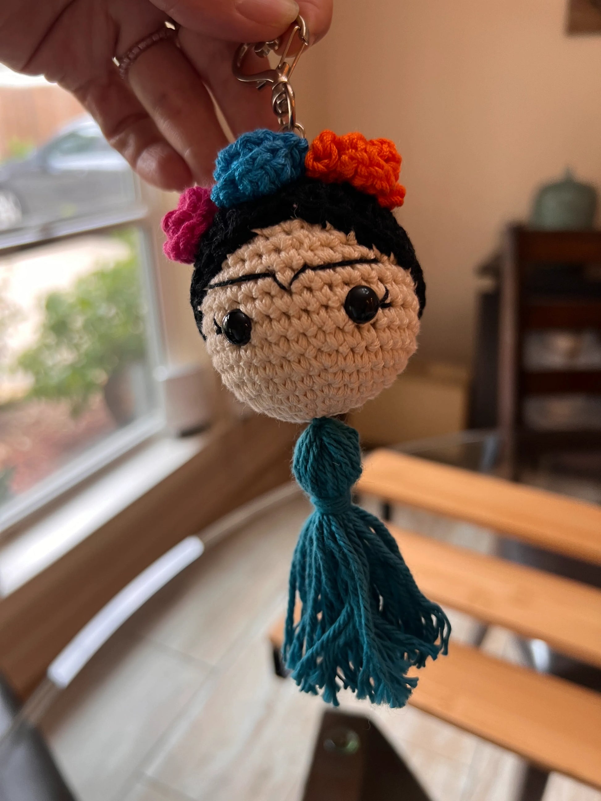 Front view of the Frida keychain plushie