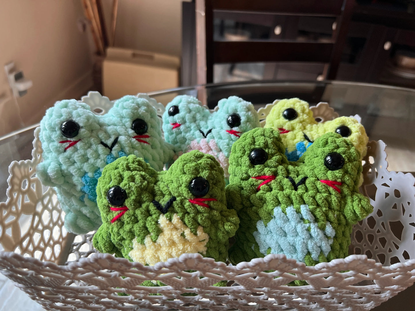 Front view of the frog plushies