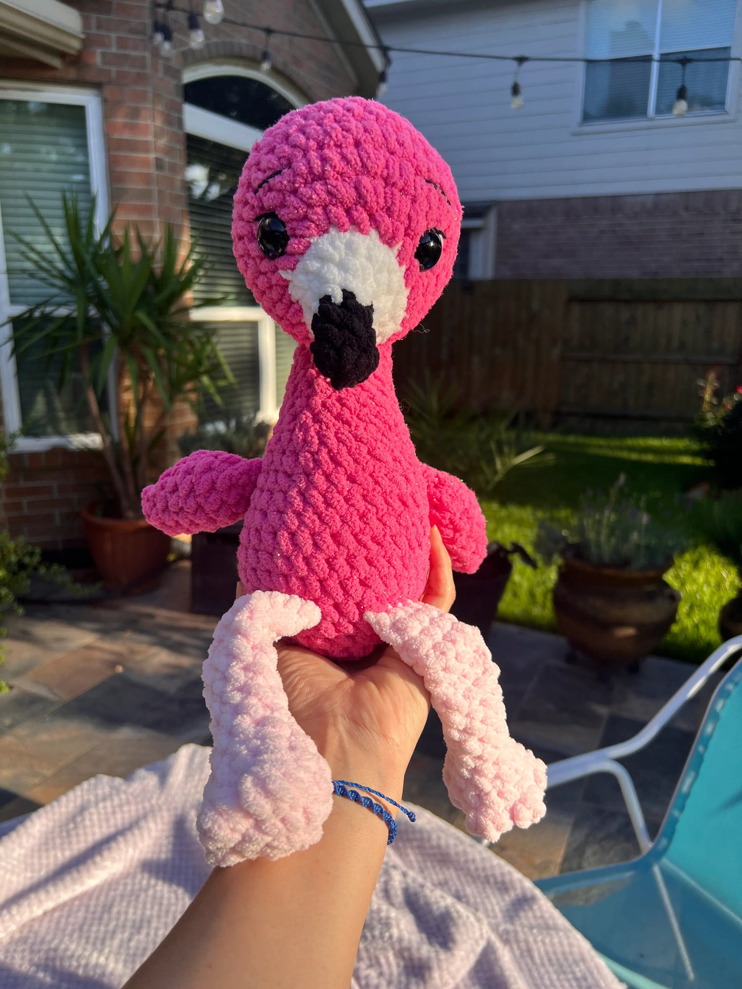 Front view of the hot pink flamingo plushie