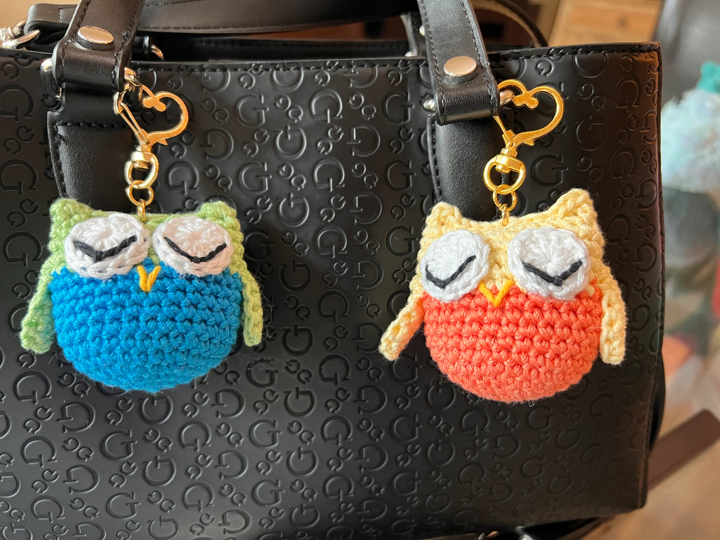 Front view of the keychain yellow and green owl plushie