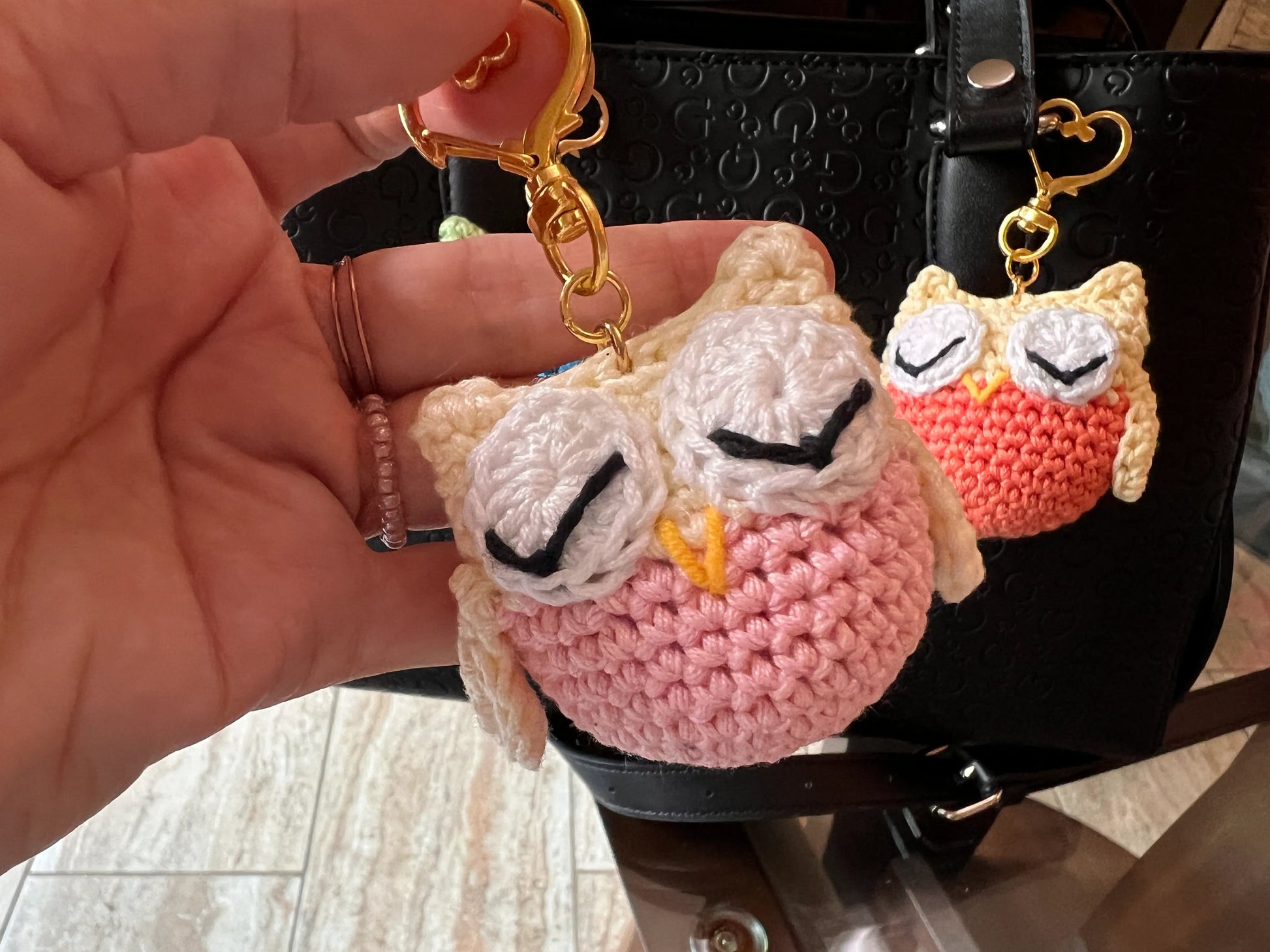 Front view of the keychain pink owl plushie