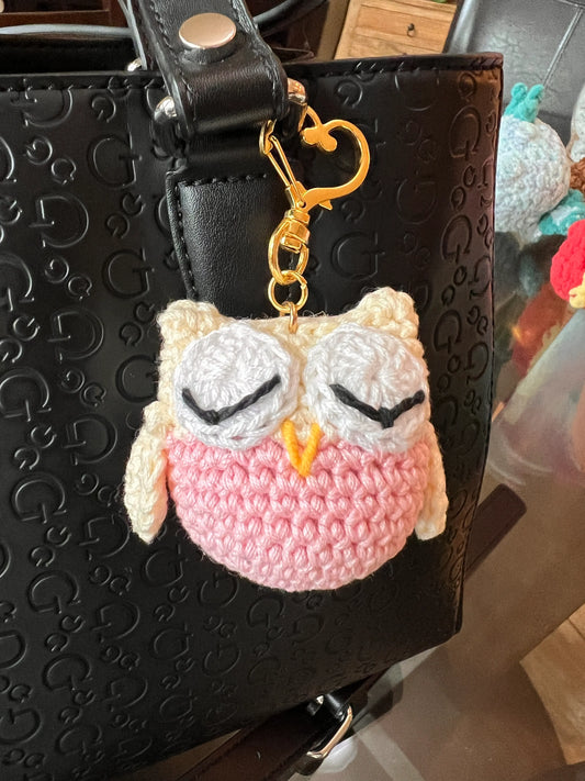 Front view of the keychain pink owl plushie