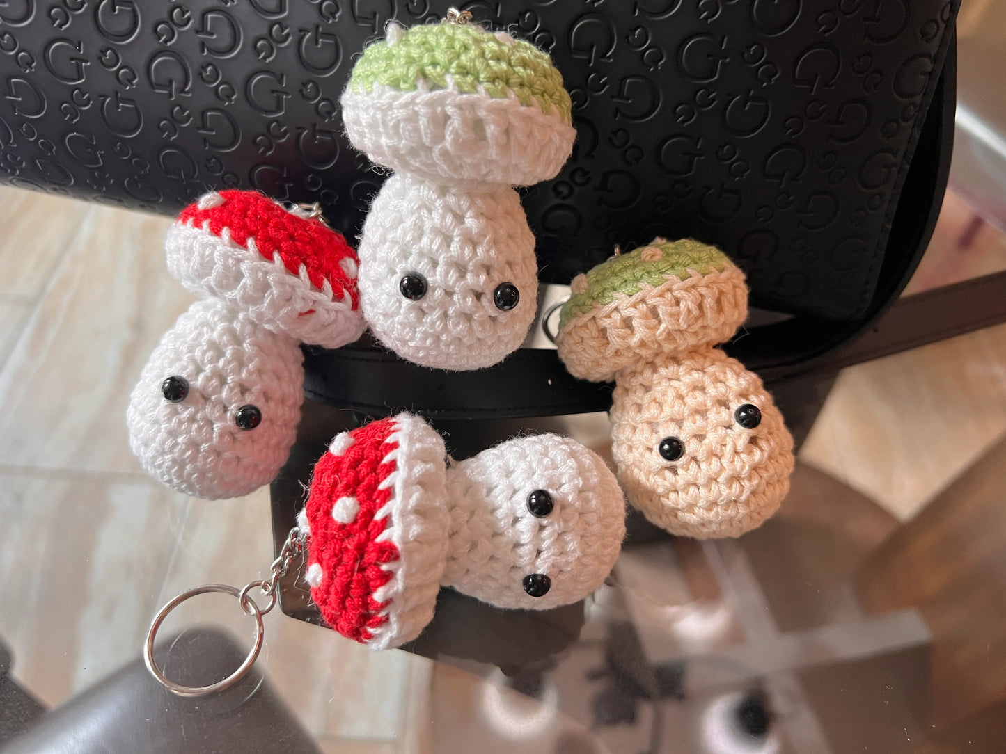 Front view of the various mushroom keychain plushies