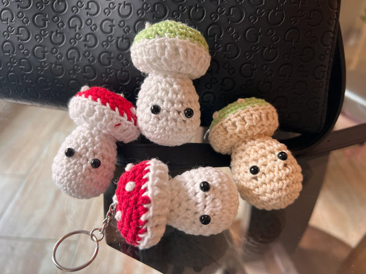 Front view of the various mushroom keychain plushies