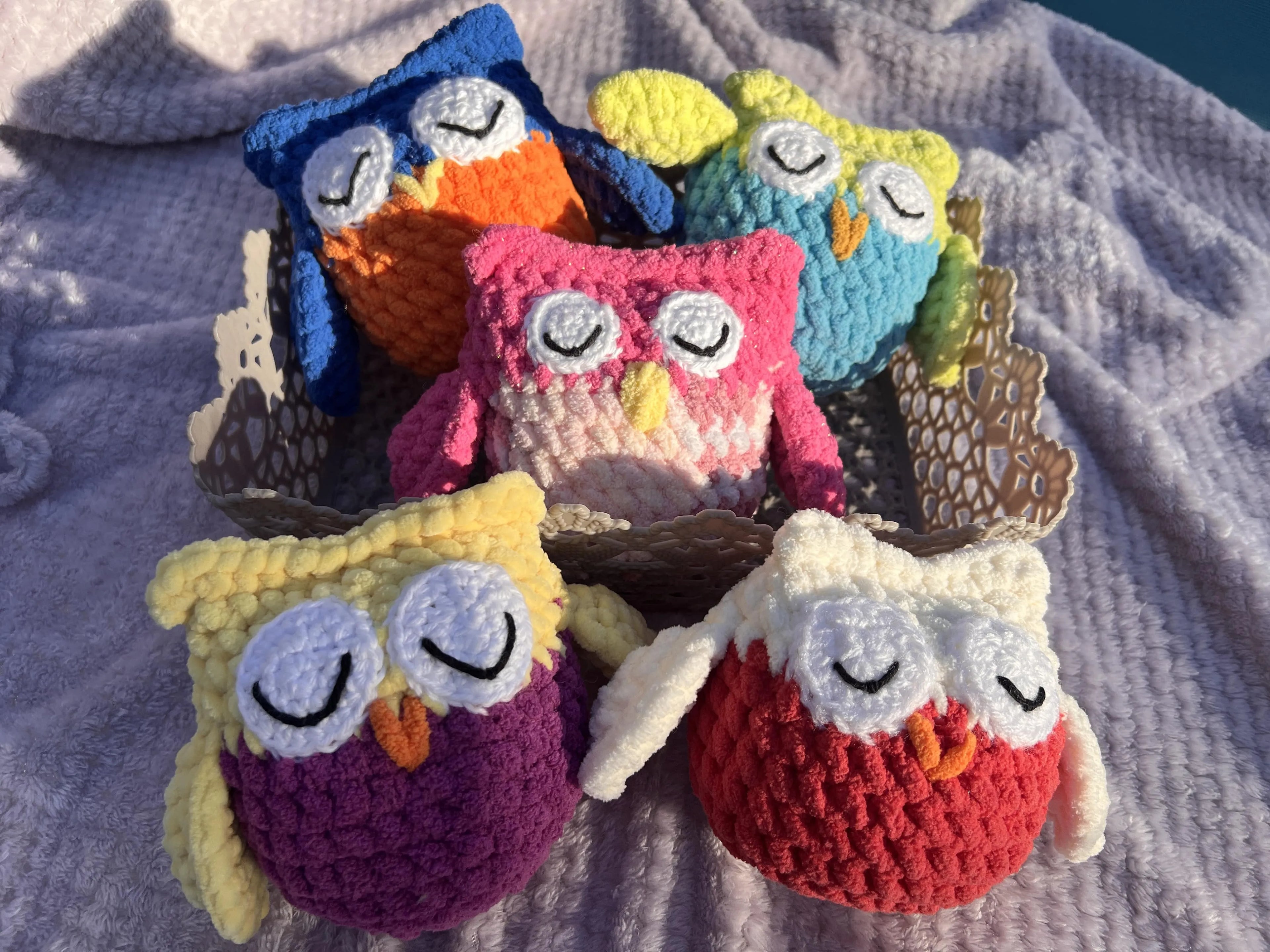 Front view of the owl plushies grouped together