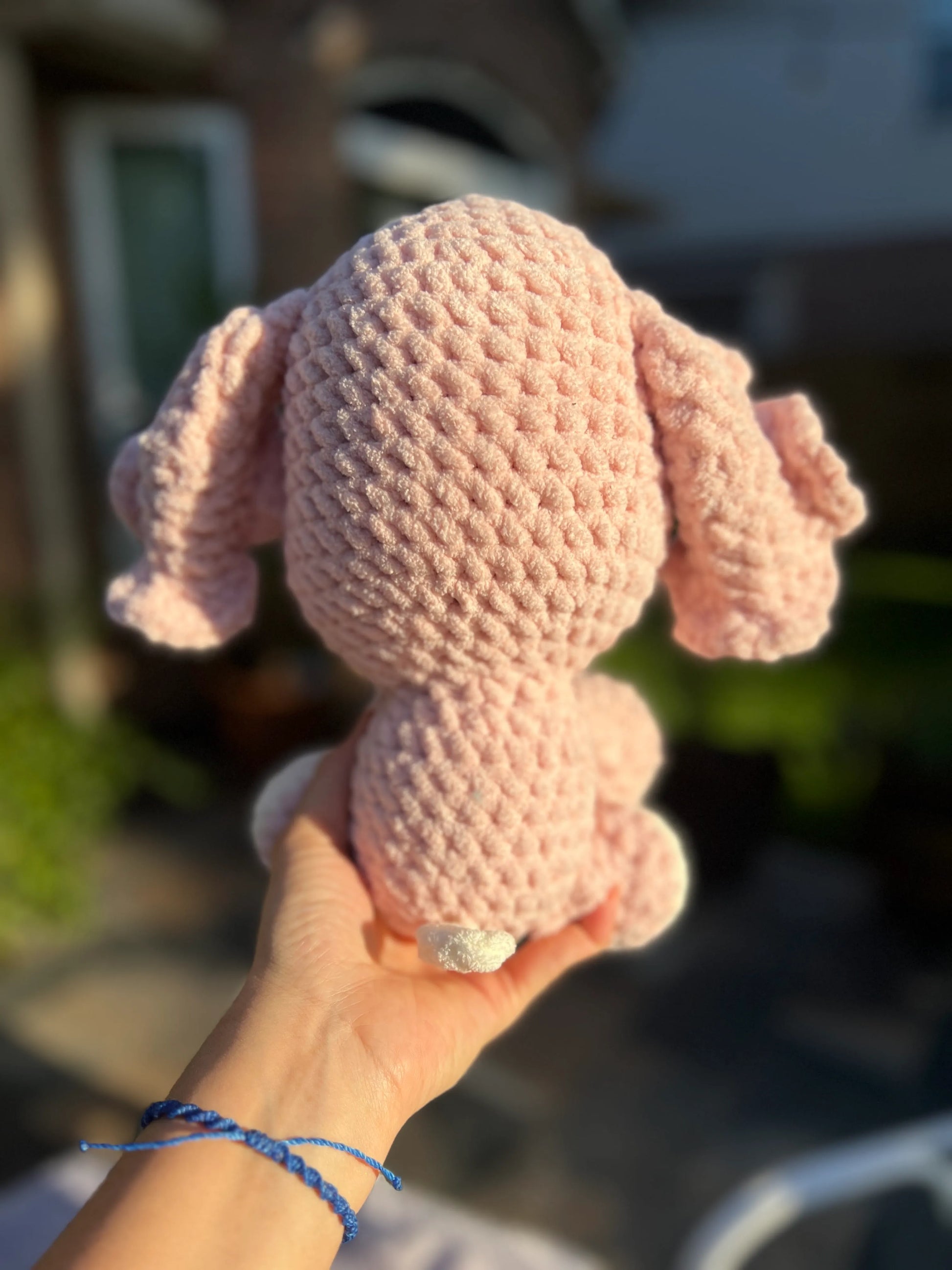 Backside view of the pink elephant plushie