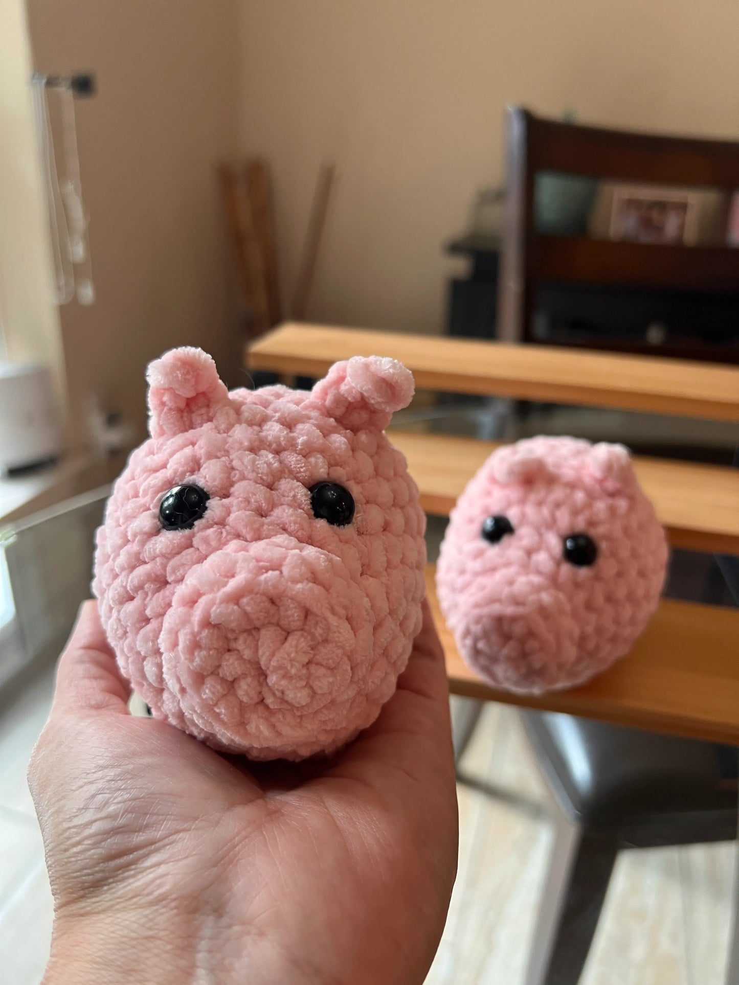 Front view of a pink pig plushie