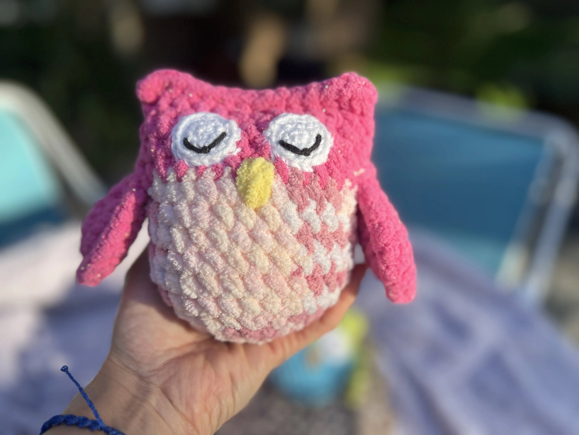 Front view of the pink mixed owl plushie