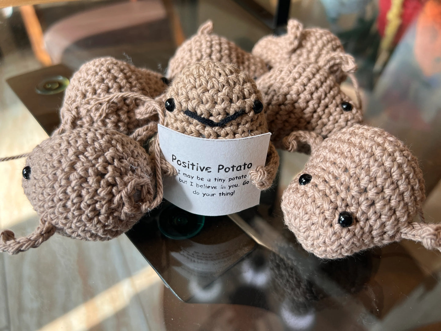 Front view of the positive potato plushies