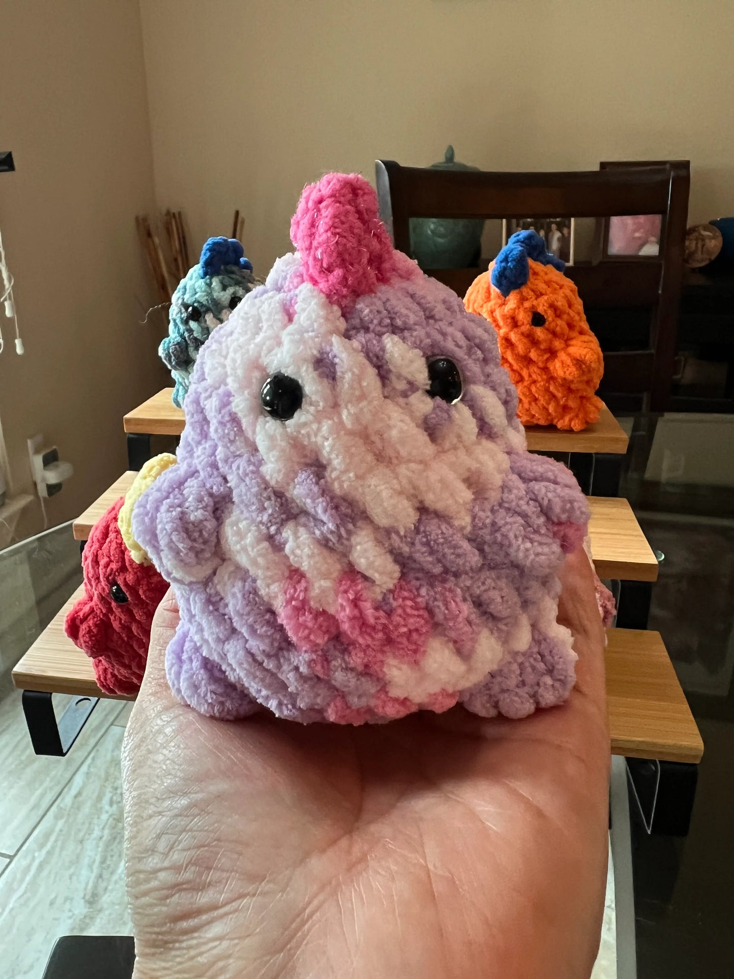 Front view of the purple mixed dinosaur plushie