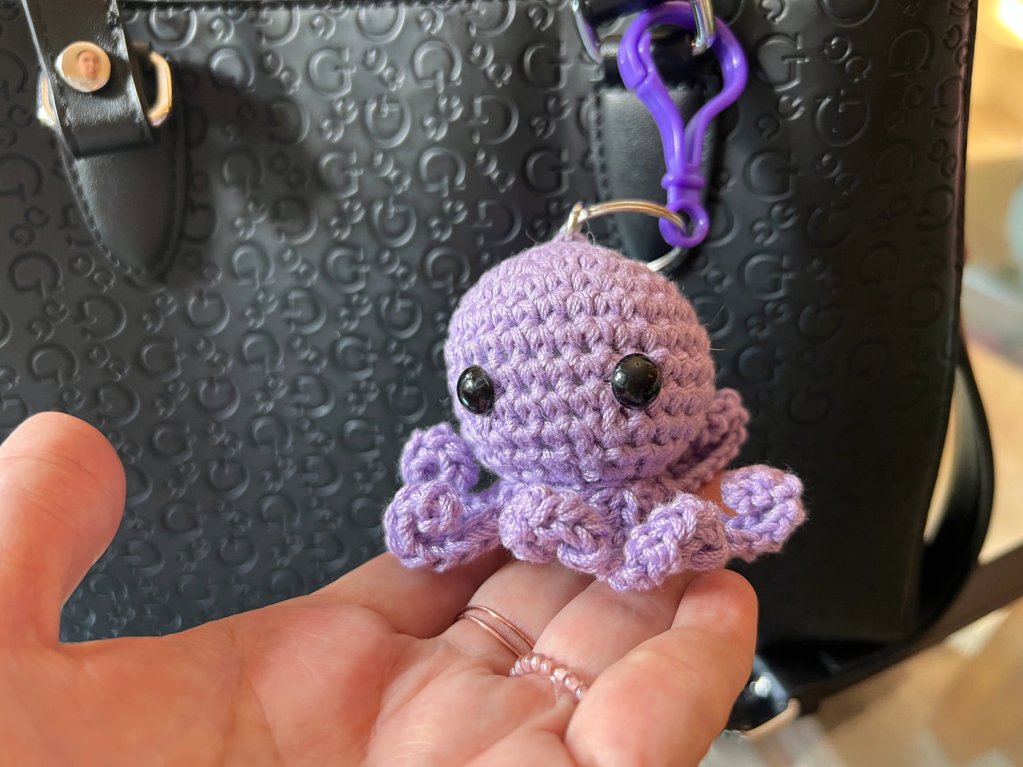 Front view of the purple octopus keychain plushie