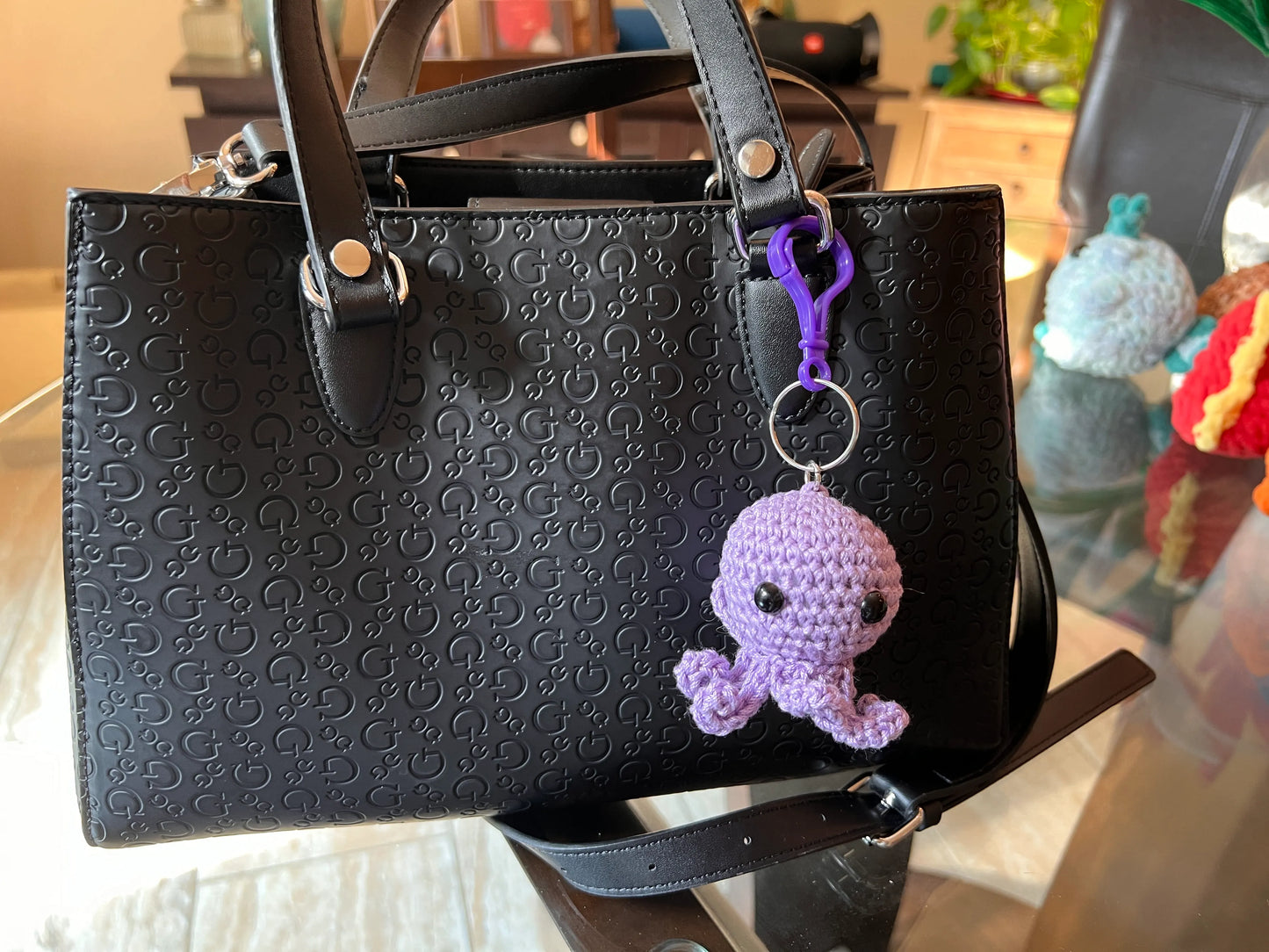 Front view of the purple octopus keychain plushie