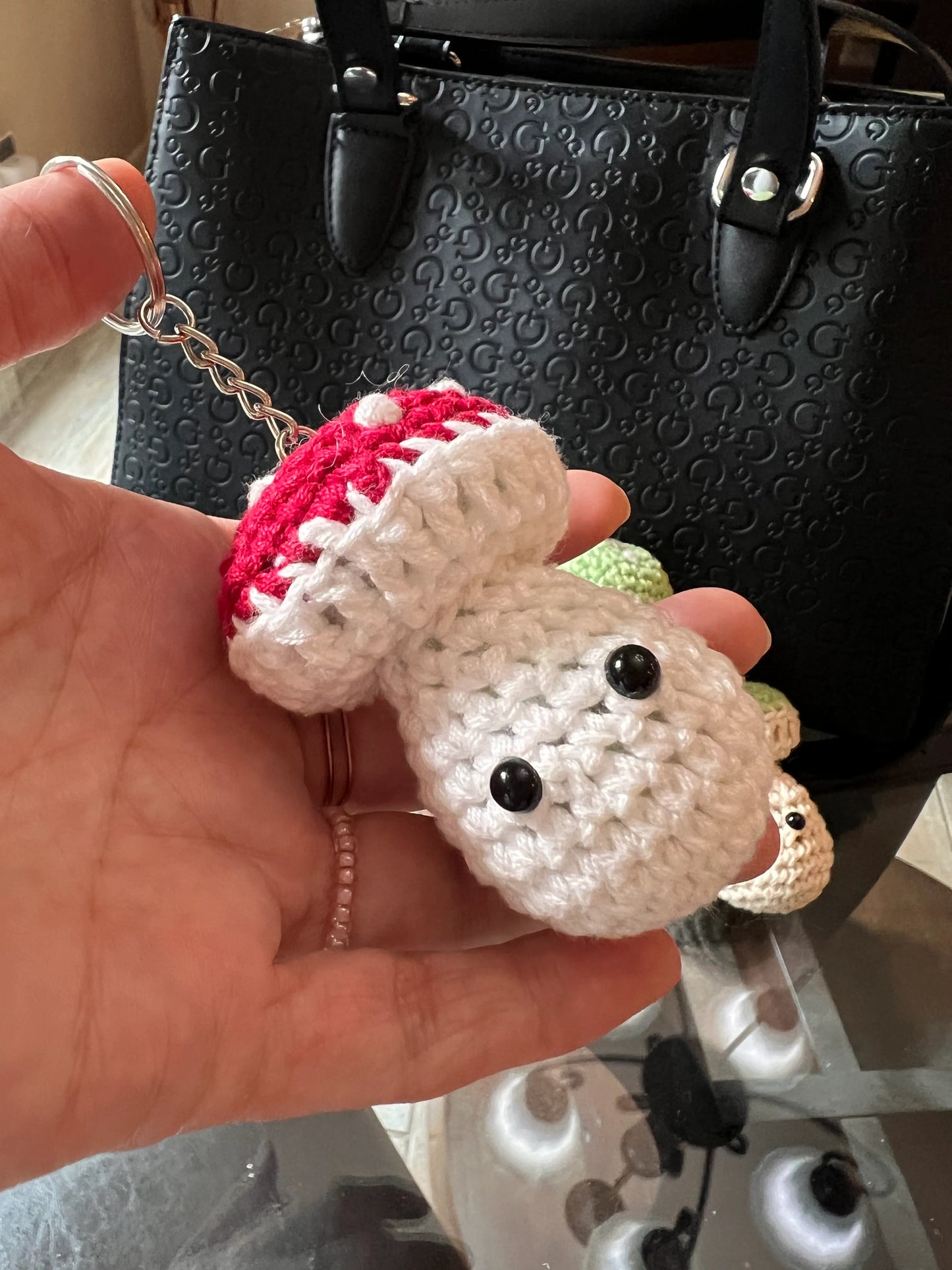 Front view of the red mushroom keychain plushies