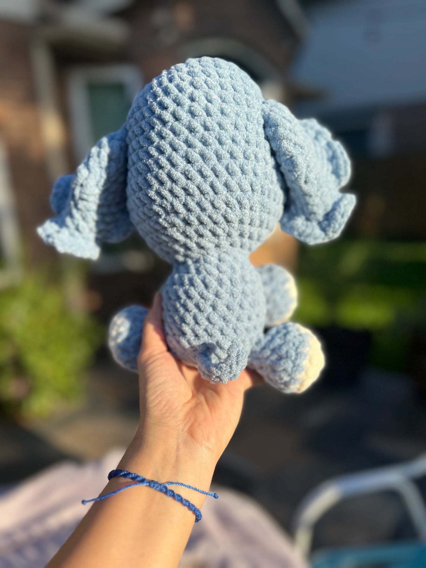 Backside view of the sky-blue plushie