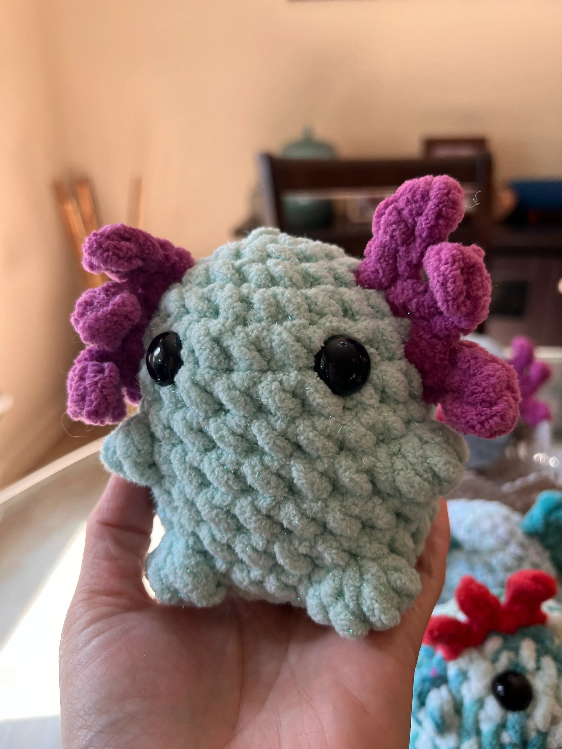 Front view of the turquoise axolotl plushie